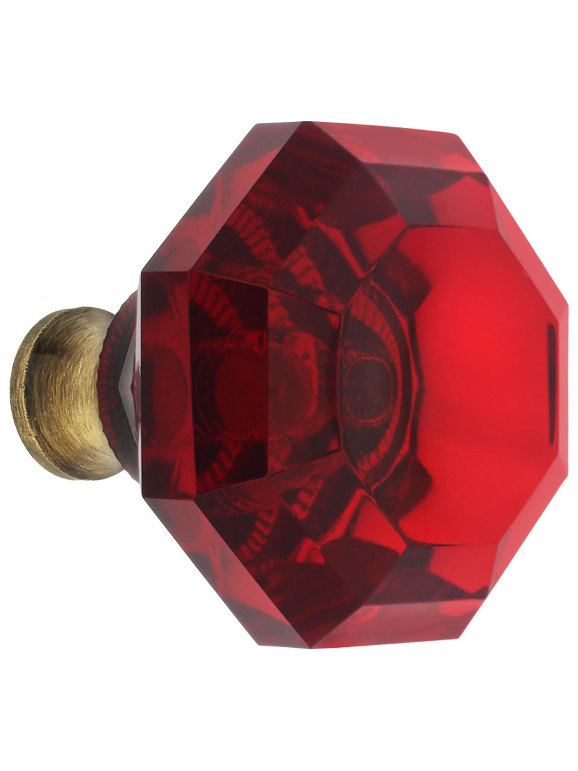Red Lead-Free Octagonal Crystal Knob with Solid Brass Base in Antique Brass.